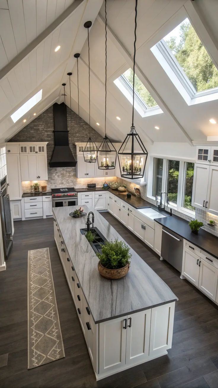 Cathedral ceiling kitchen with skylights and marble island