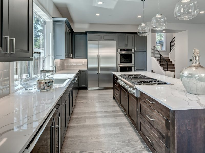Modern kitchen with quartz countertops and stainless appliances